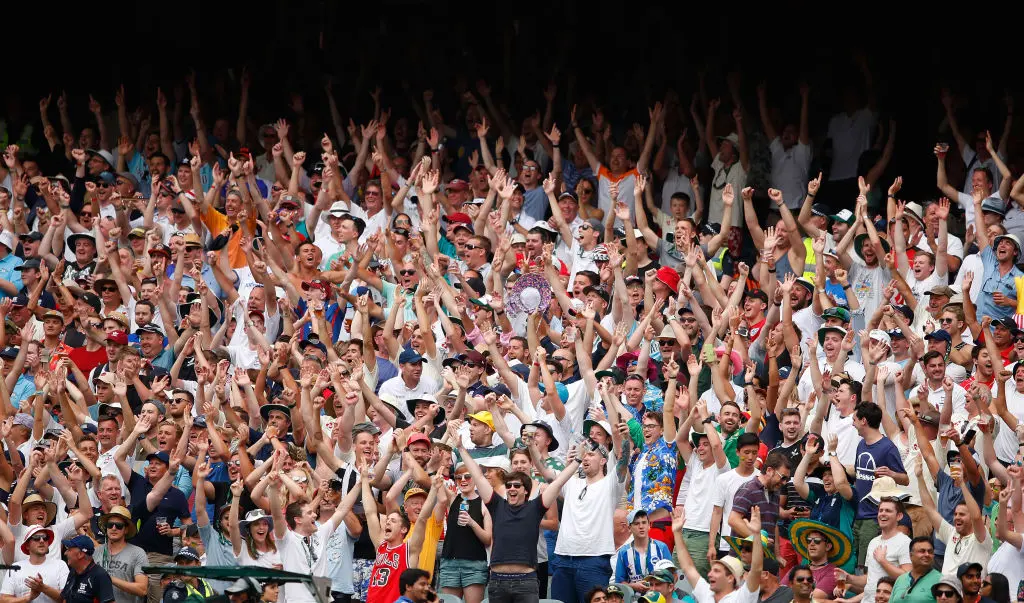 Barmy Army supporters in the stands wearing official kit